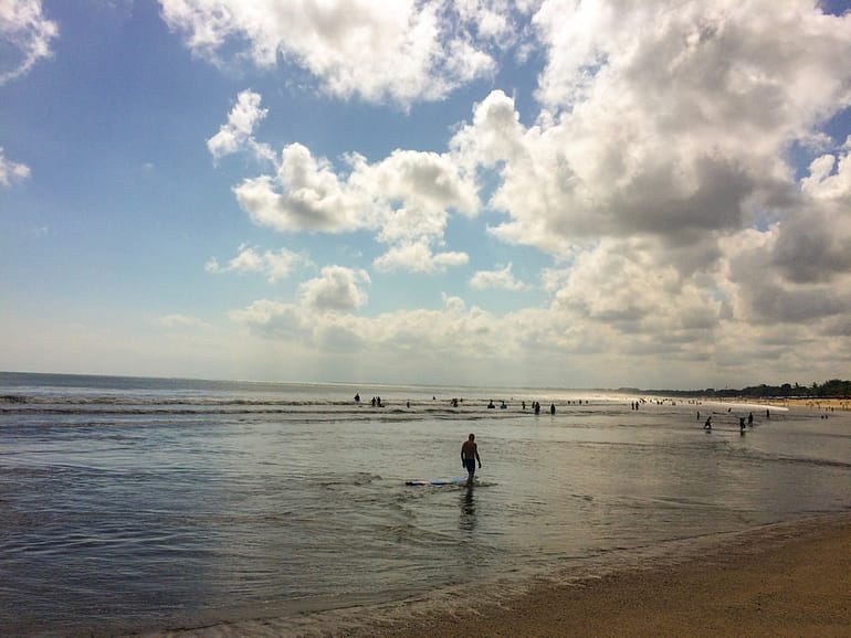 visiting a beach and going surfing is one of the best things to do in Bali